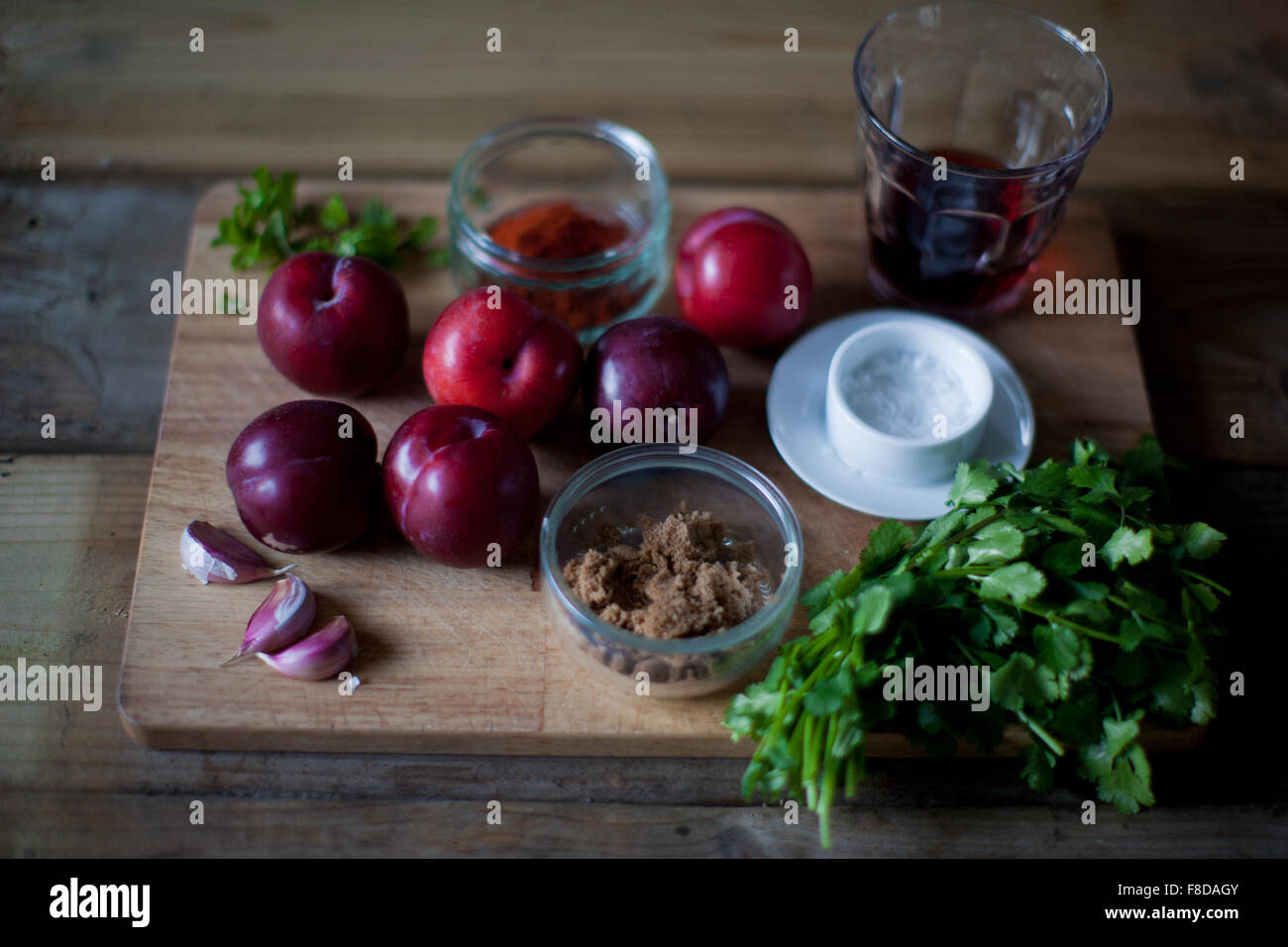 Tkemail, Georgian plum sauce ingredients are ready for this tart, sweet sauce that accompanies meat and other savoury dishes Stock Photo