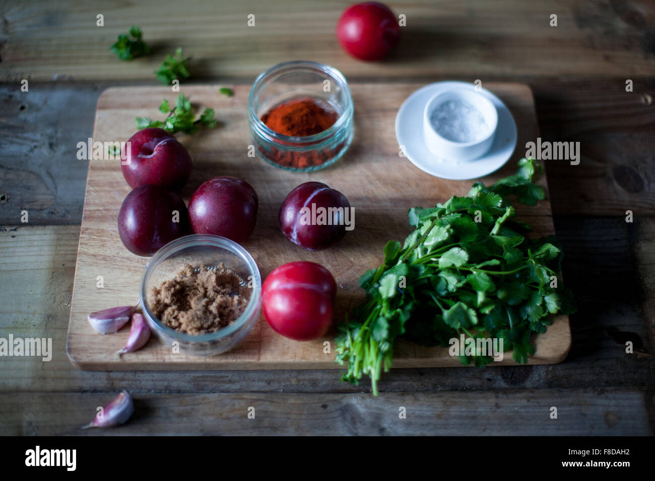 Tkemail, Georgian plum sauce ingredients are ready for this tart, sweet sauce that accompanies meat and other savoury dishes Stock Photo