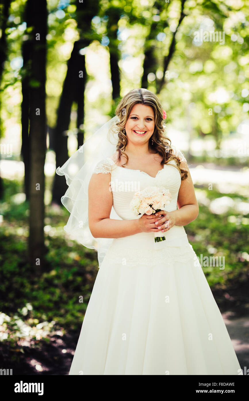 Bride alone happy outdoors hi-res stock photography and images - Alamy