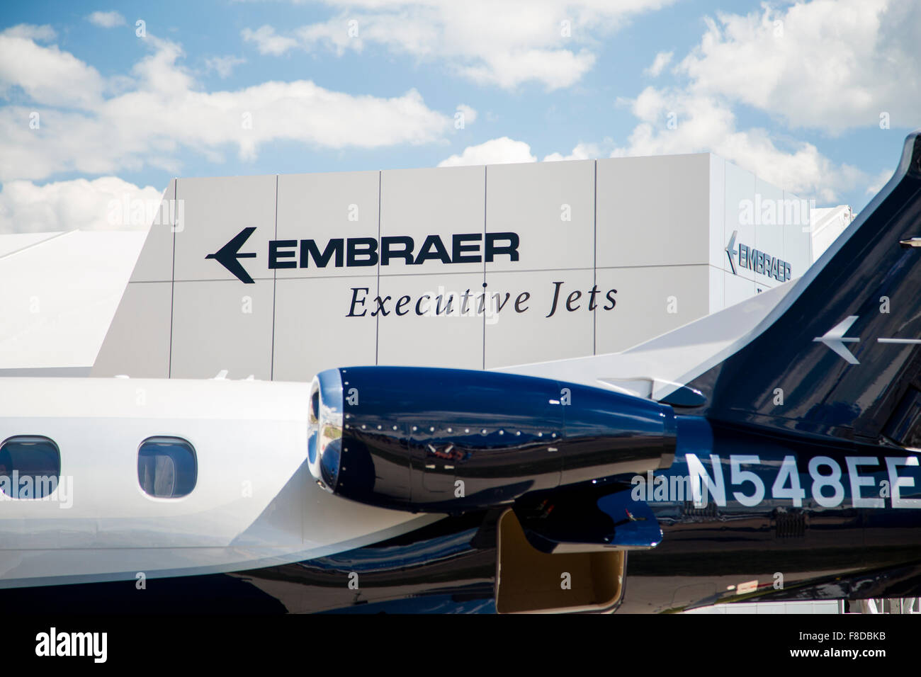 Embraer Executive Jets logo and part of a jet an air show Stock Photo