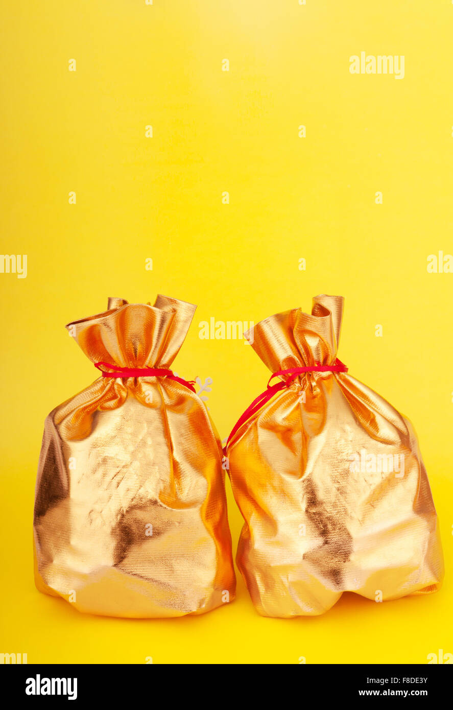 Golden sacks full of something good Stock Photo Alamy