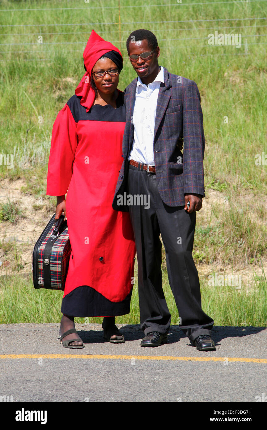Modern South African couple staying by the road and posing to the camera Stock Photo