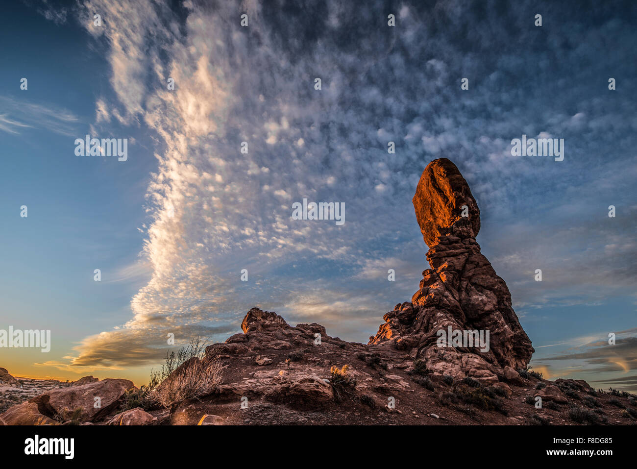Balanced Rock and clouds, Arches National Park, Utah Entrada sandstone Stock Photo