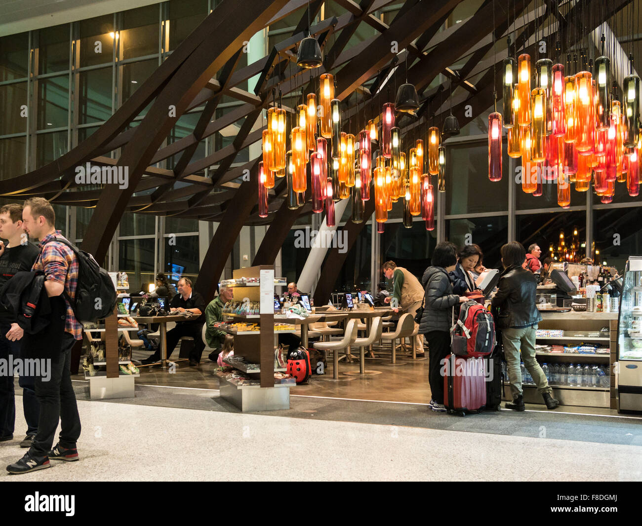 Toronto international airport Terminal 1 departure lounge food court; modern and dining tables connected with tablets and iPads Stock Photo