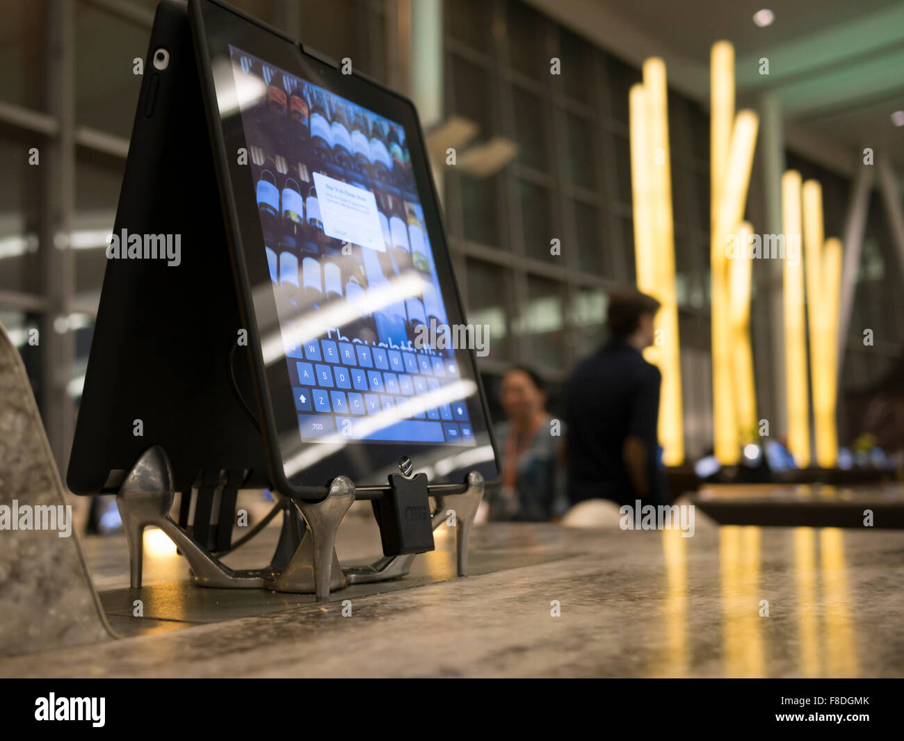 Toronto international airport Terminal 1 departure lounge food court; modern and dining tables connected with tablets and iPads Stock Photo