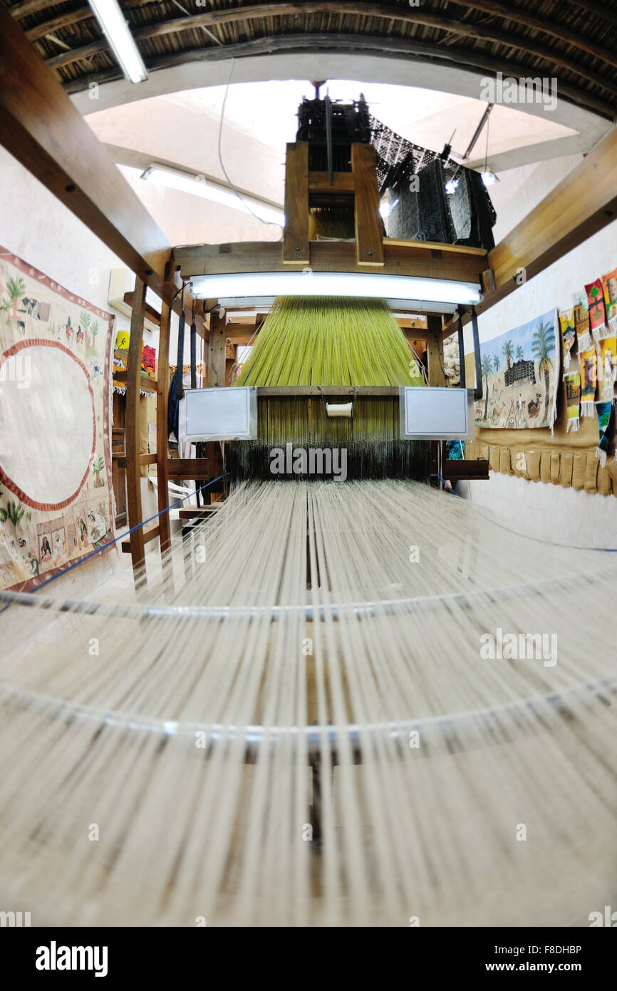 old wooden machine for produce traditional arabic rug Stock Photo - Alamy