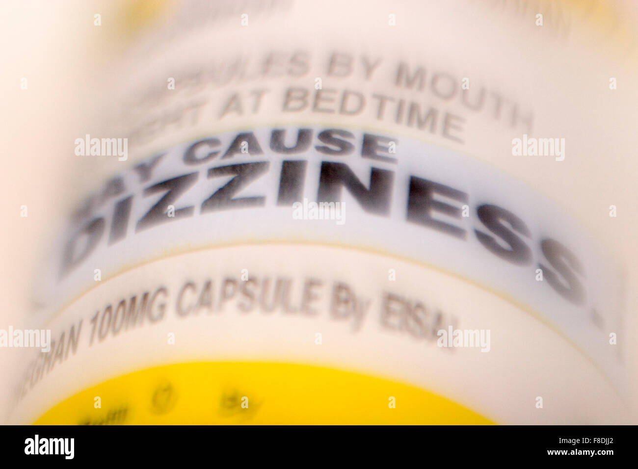 'May Cause Dizziness,' warning label on prescription bottle. Stock Photo