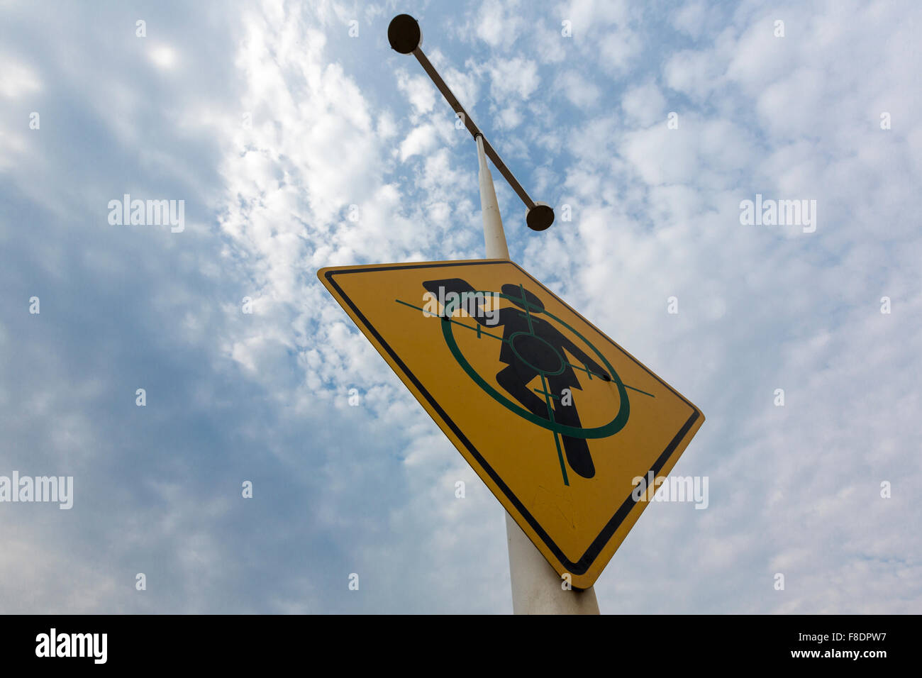 Yellow sign of target with Child and cloudy sky, Memory Park Stock Photo
