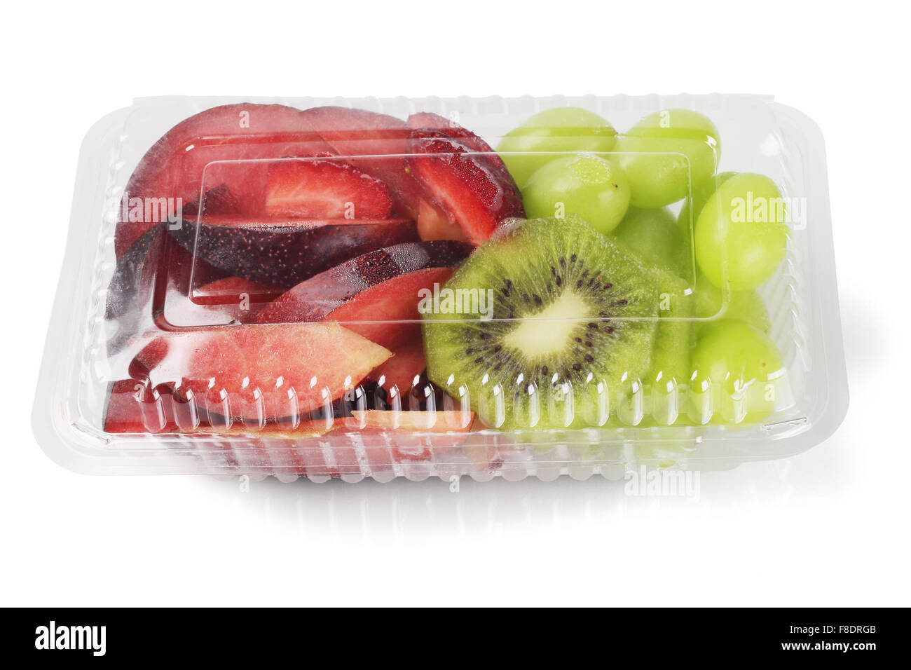 Mixed Cut Fruits in Plastic Box on White Background Stock Photo