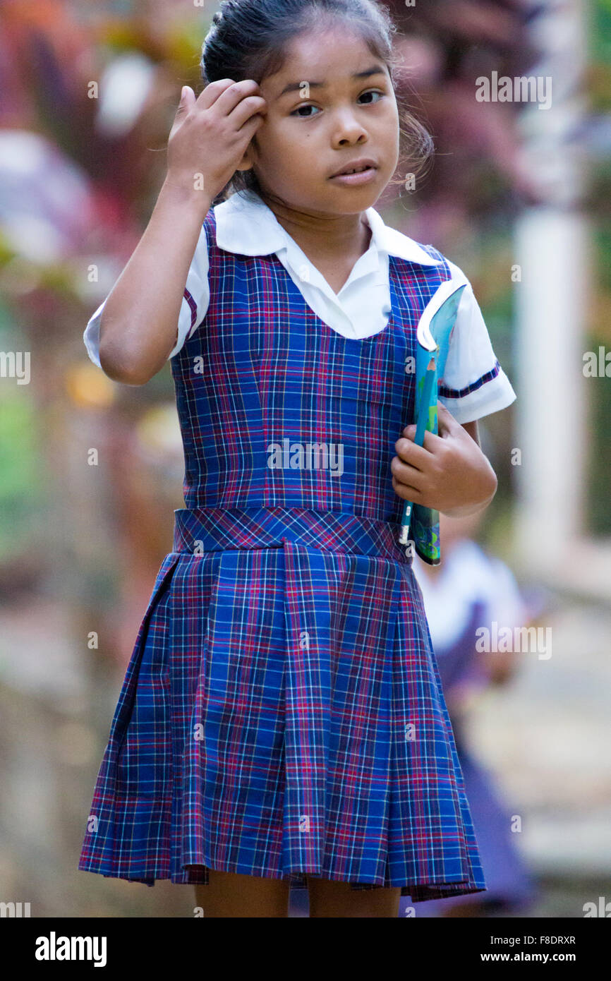 Cute young student girl with a book and a pencil Stock Photo - Alamy