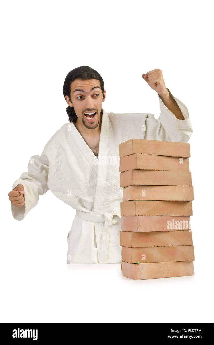 Karate man breaking bricks on white Stock Photo Alamy