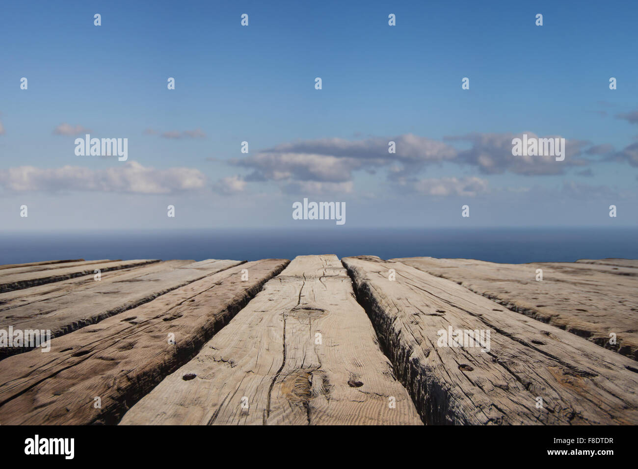 vacation background - wooden board floor with ocean horizon in background Stock Photo