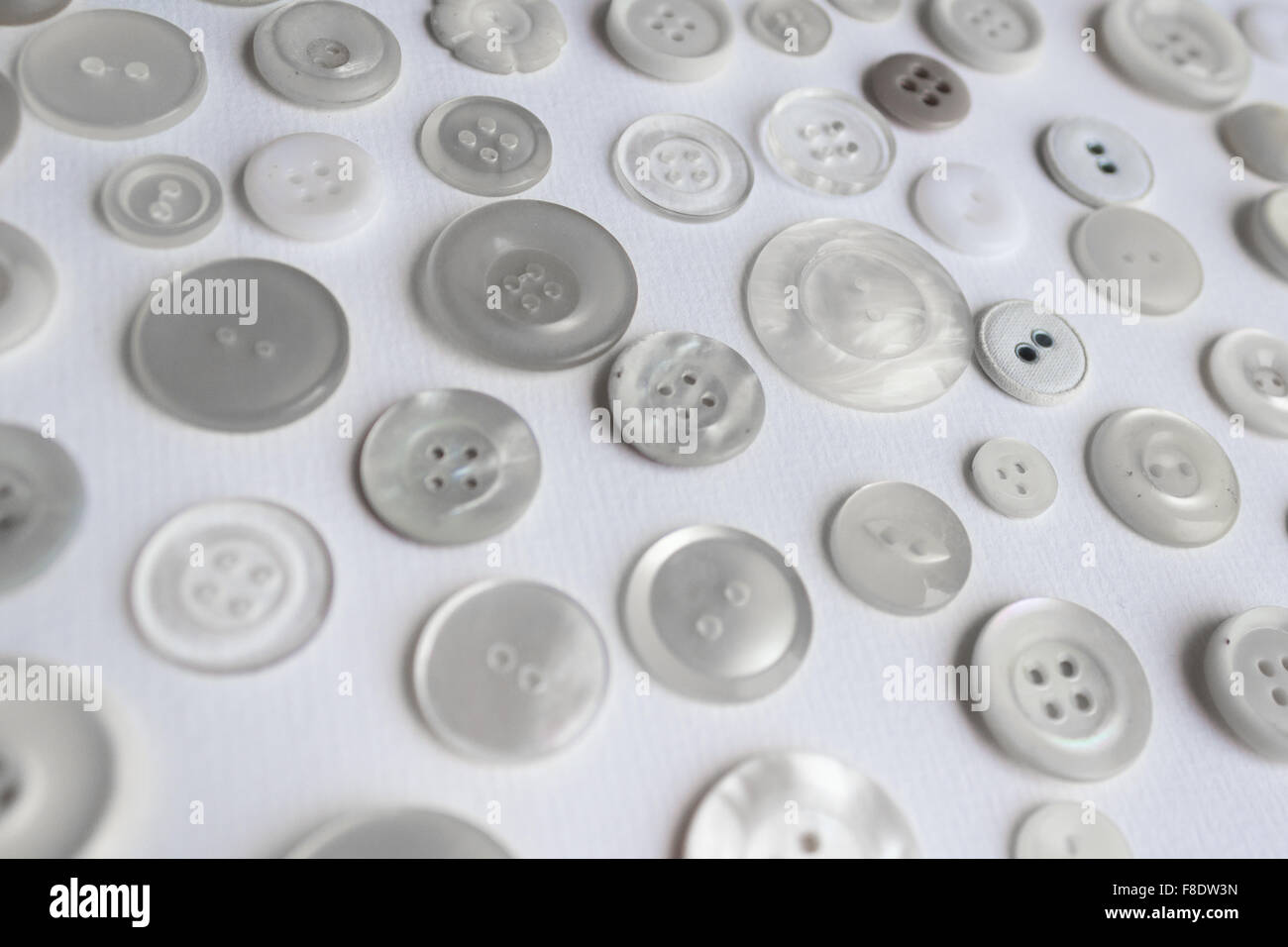many clothing buttons on white background Stock Photo