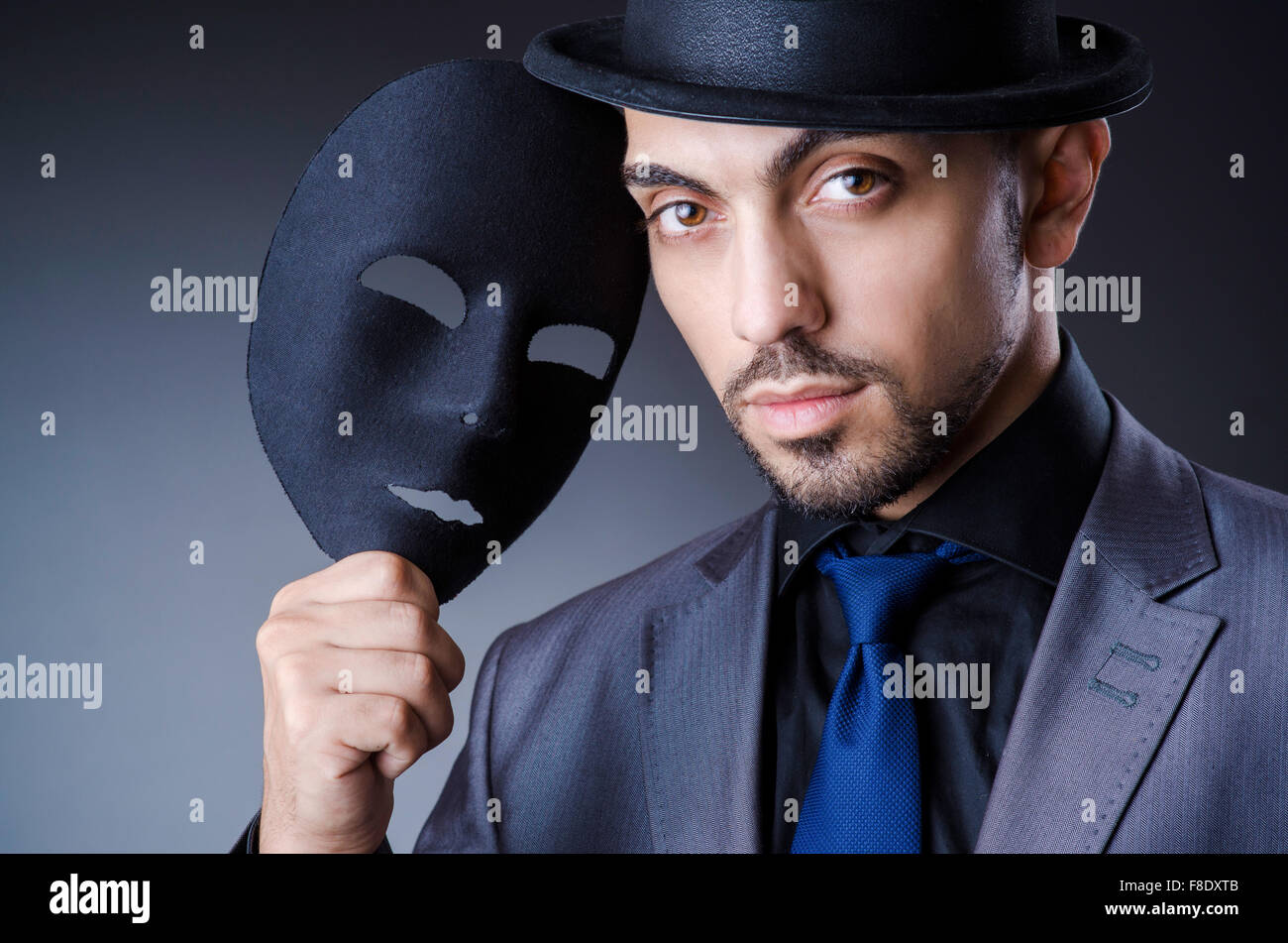 Man with black mask in studio Stock Photo Alamy