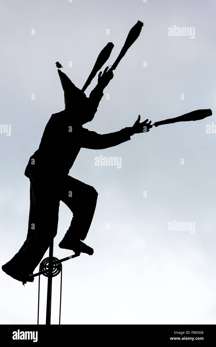 Silhouette of clown on unicycle in La Candelaria, Bogota Stock Photo
