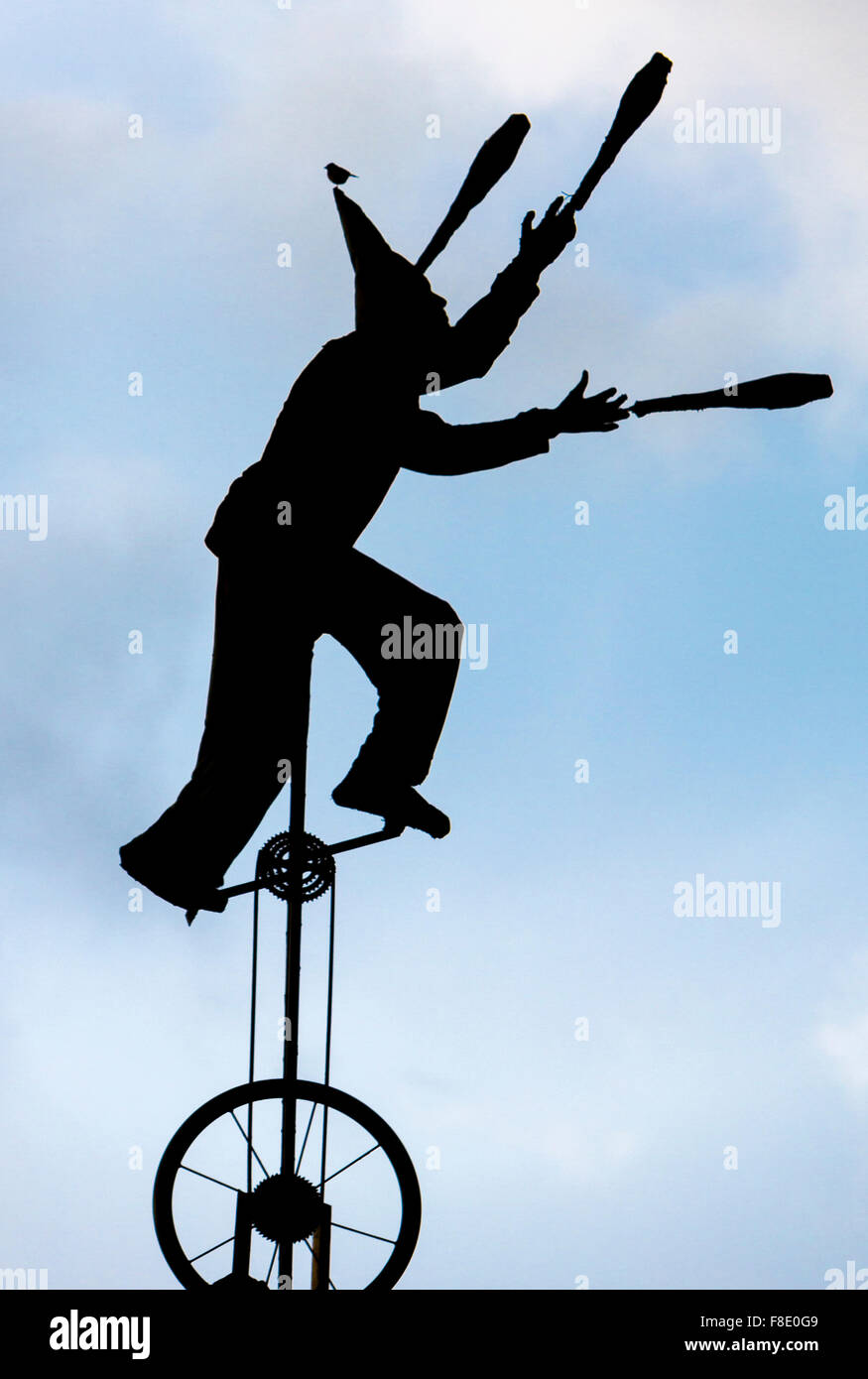 Silhouette of clown on unicycle in La Candelaria, Bogota Stock Photo