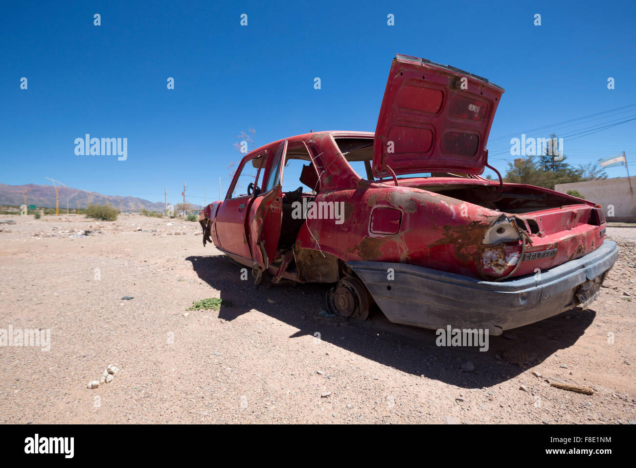 Abandonned red old Peugeot car on ruta 40, Argentina Stock Photo