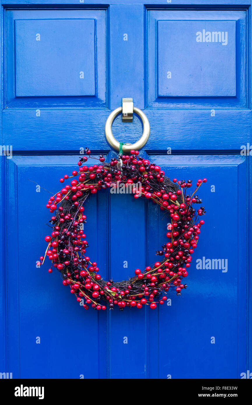 Christmas wreath on a blue coloured wooden door Stock Photo
