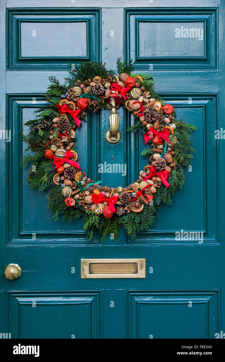 Christmas wreath on a teal coloured wooden door Stock Photo