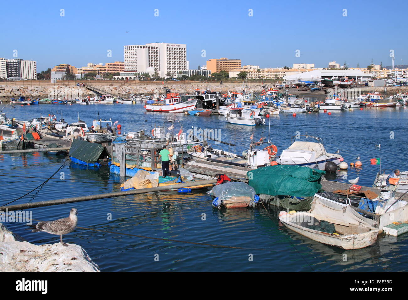 Quarteira fishing harbour, with Crowne Plaza beyond, Vilamoura Stock