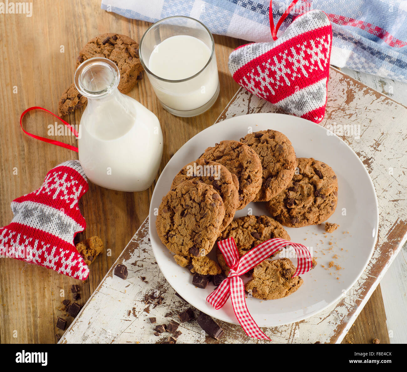 Chocolate chip cookies with milk on a wooden background. Top view Stock Photo