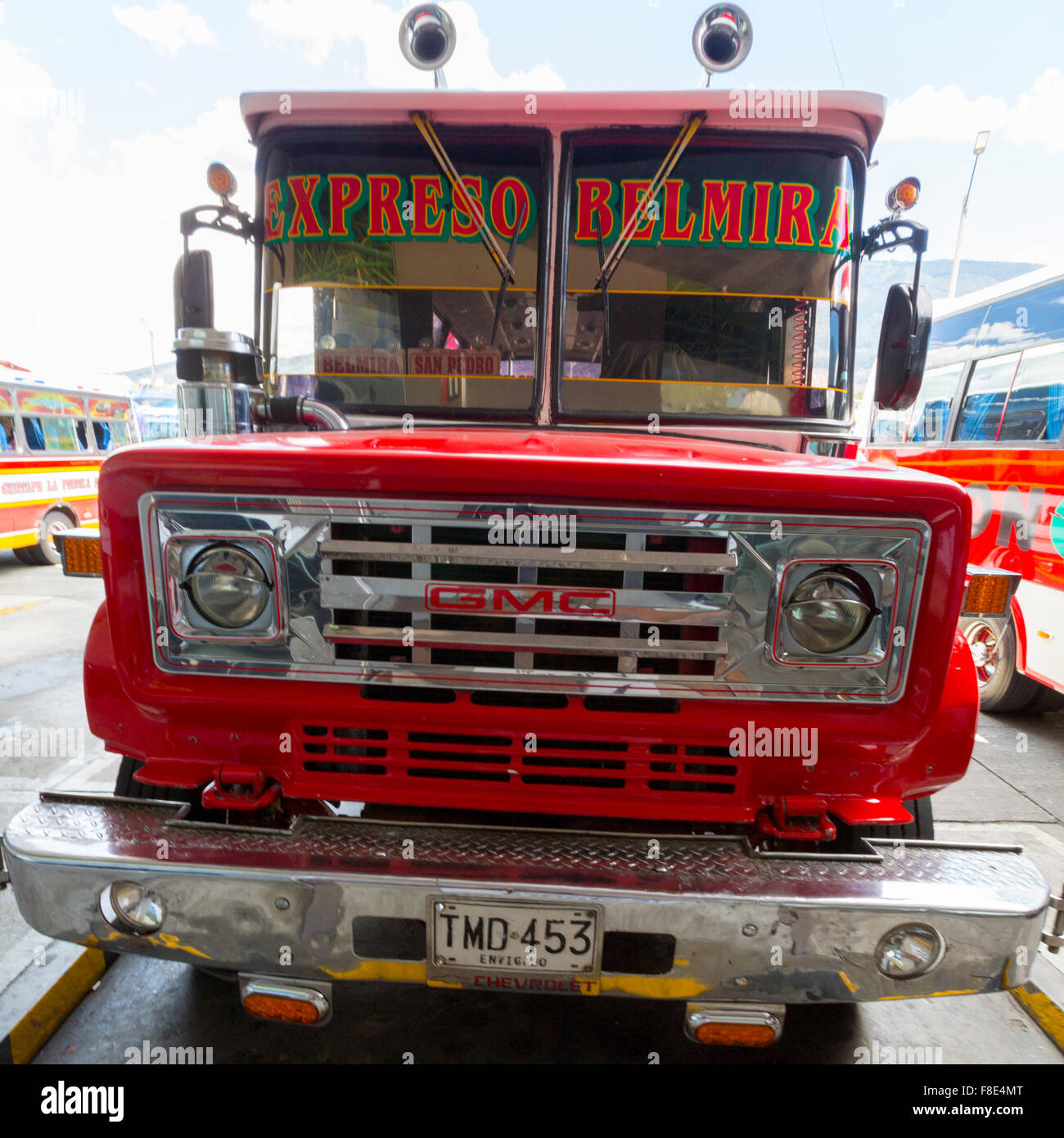 Red vintage GMC bus in Medellin, Colombia Stock Photo