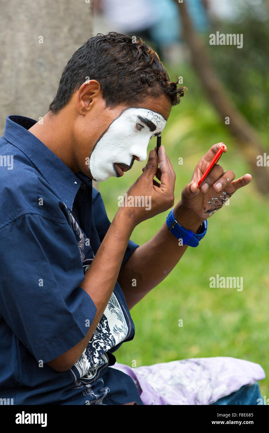 Clown getting ready in a park in Medellin, Colombia Stock Photo