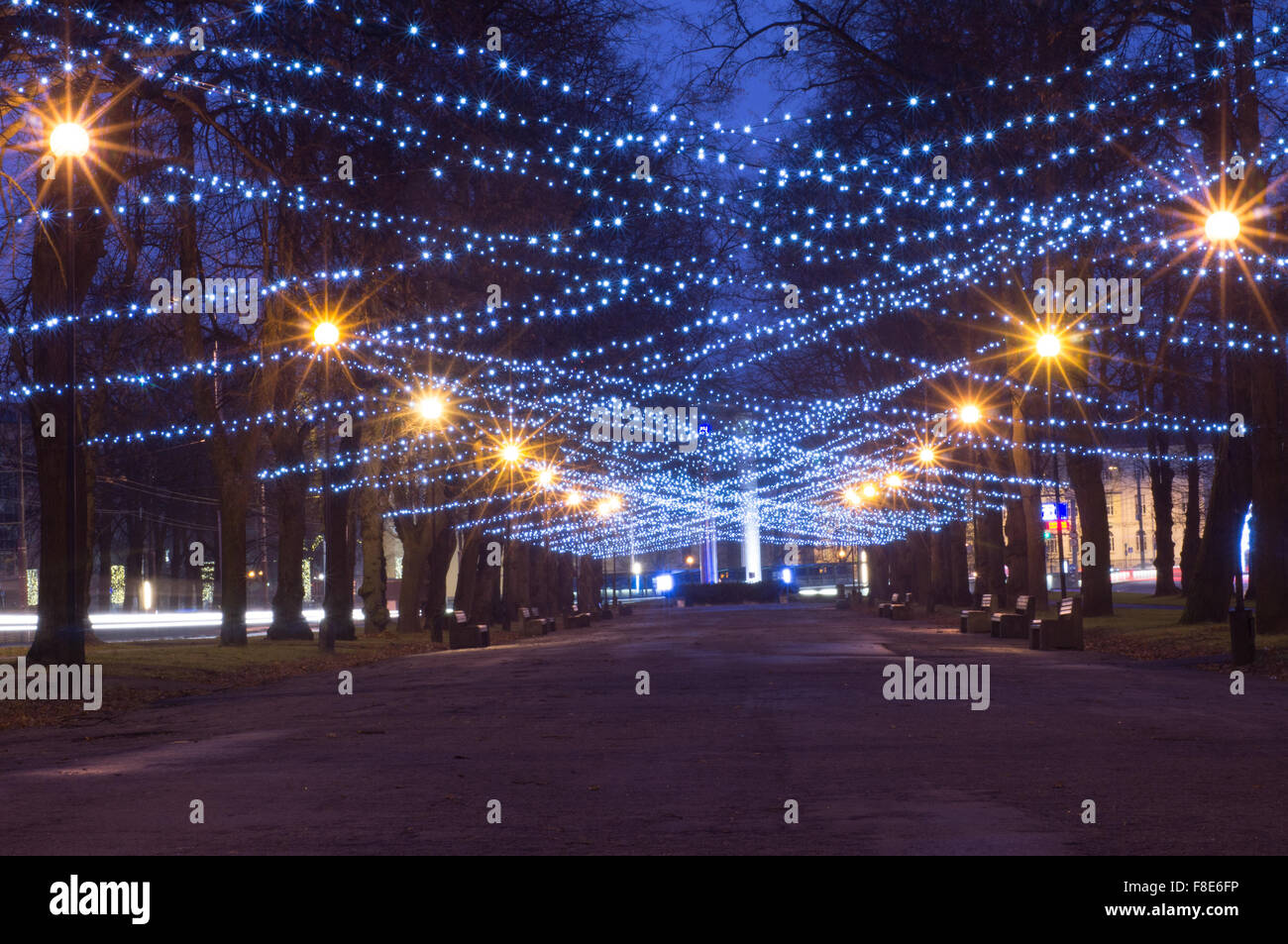 New Year and Christmas festoon illumination on city alley Stock Photo