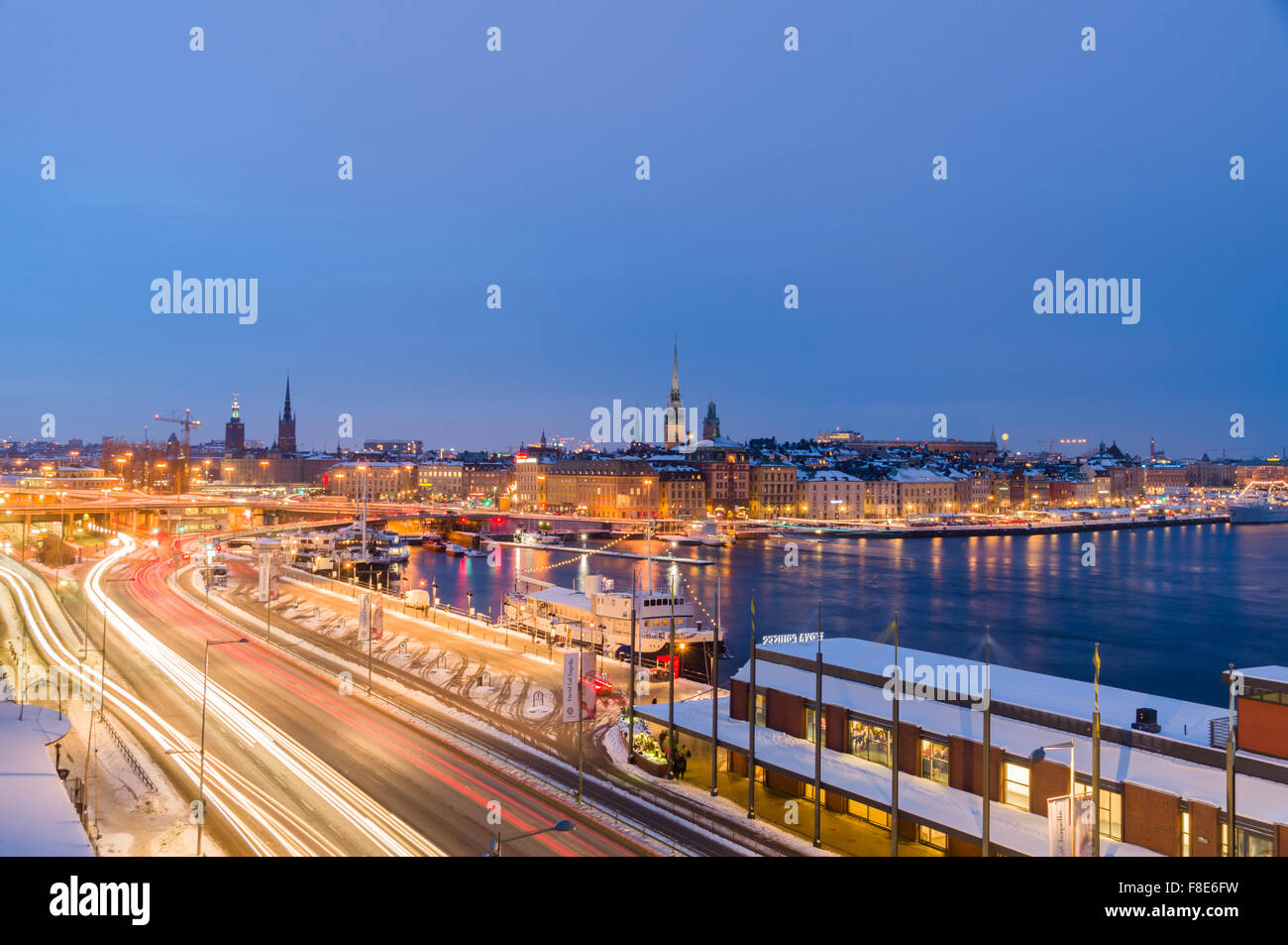 STOCKHOLM, SWEDEN - JANUARY 26, 2013: Night winter cityscape. Malaren lake and trails of traffic lights. Stock Photo