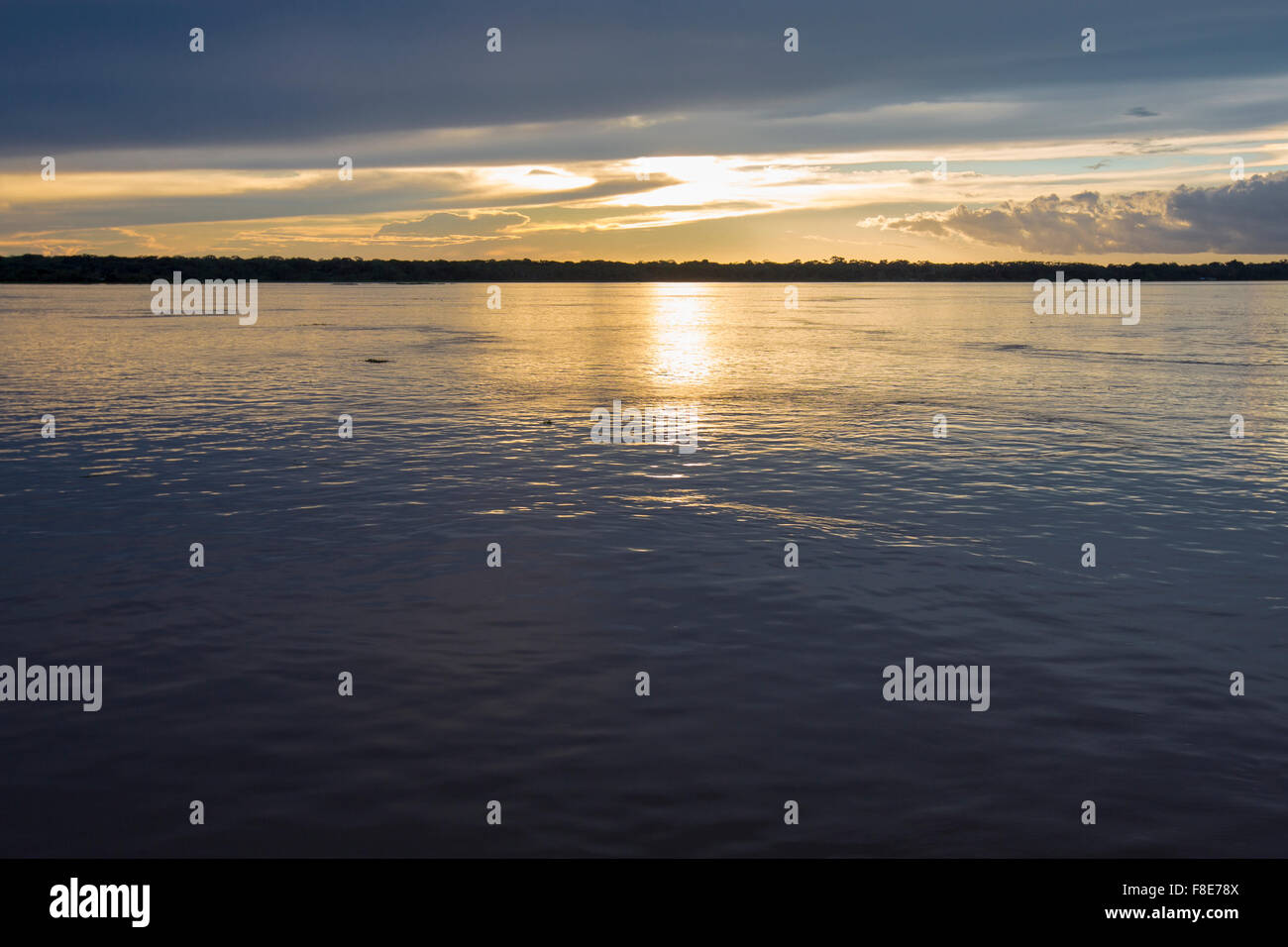 Wonderful panoramic yellow sunset on the large river Amazon. Amazonas State, Brazil Stock Photo