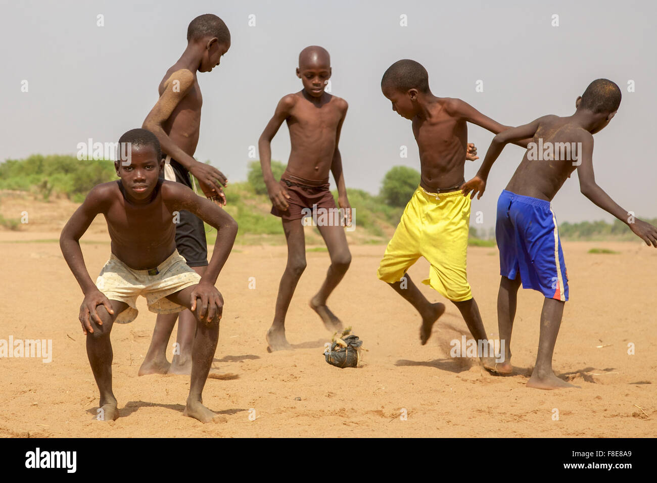 Young kids playing soccer in Saint Louis, Senegal Stock Photo