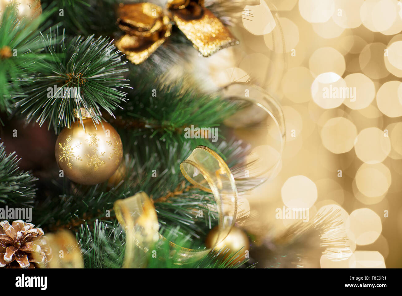 Christmas tree with gold blurred light background Stock Photo