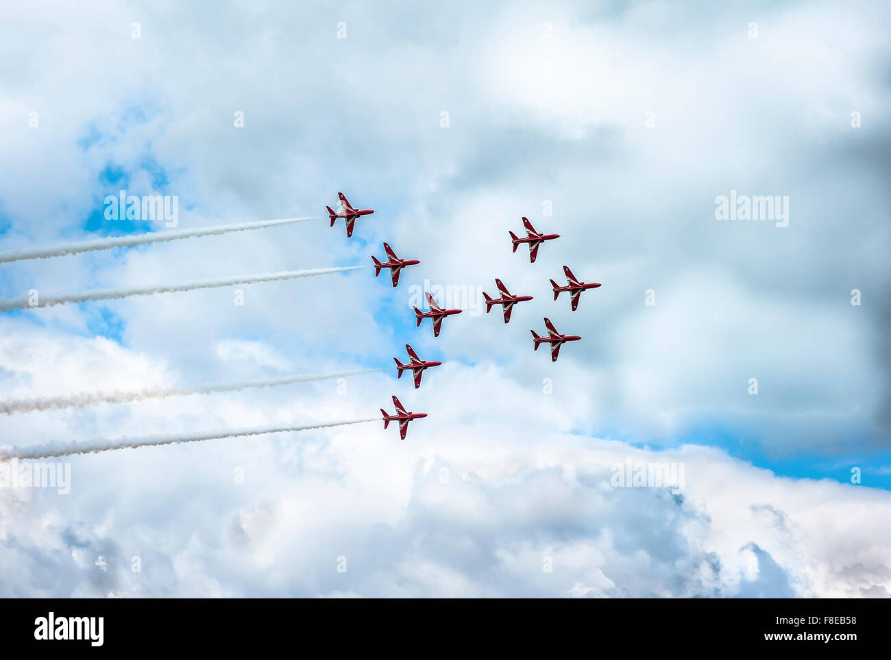 Red Arrows aerobatic team performing a Typhoon-Viggen manoeuvre at a public air show in England Stock Photo
