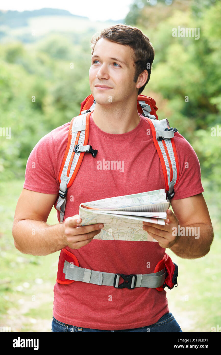 Young Man On Hike Through Countryside Stock Photo