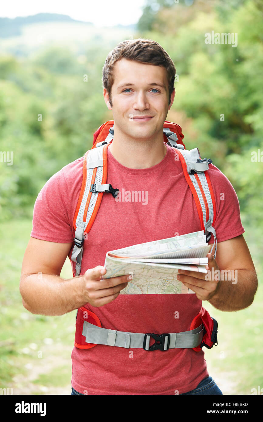 Young Man On Hike Through Countryside Stock Photo