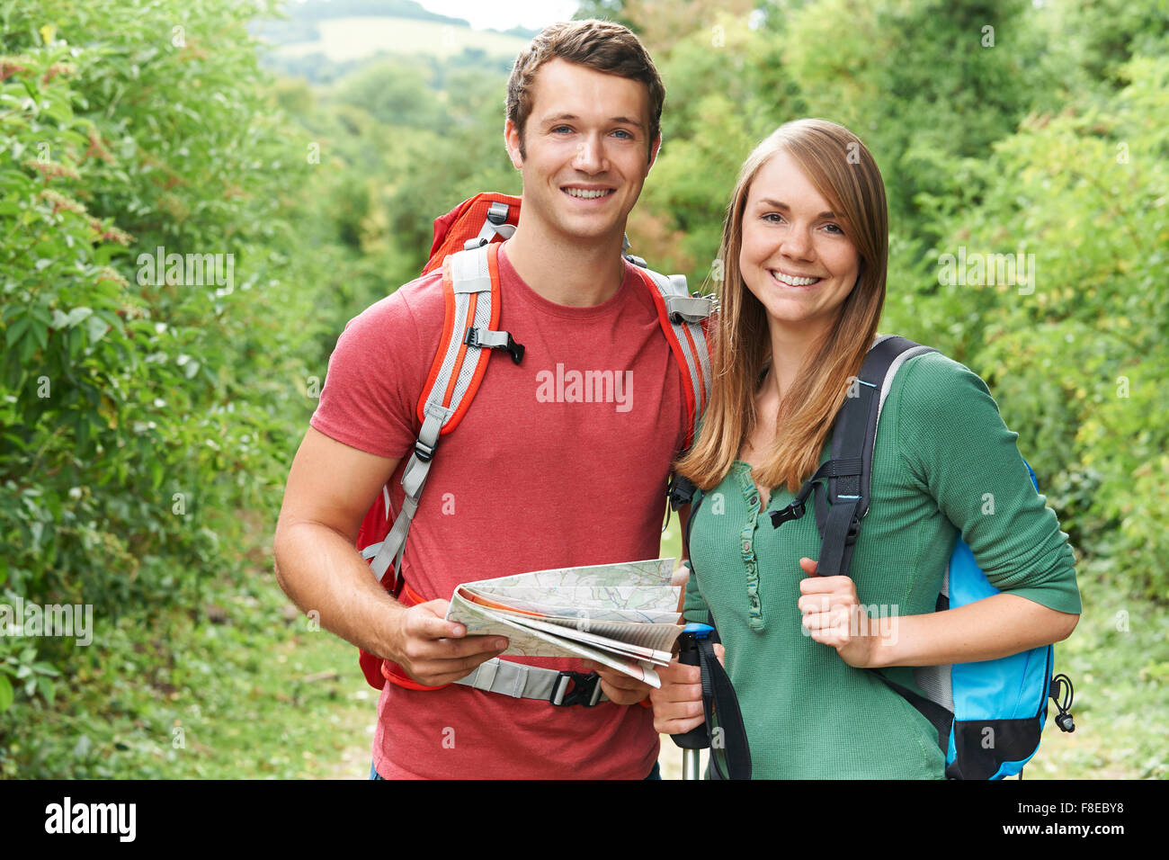 Young Couple Hiking In The Countryside Stock Photo