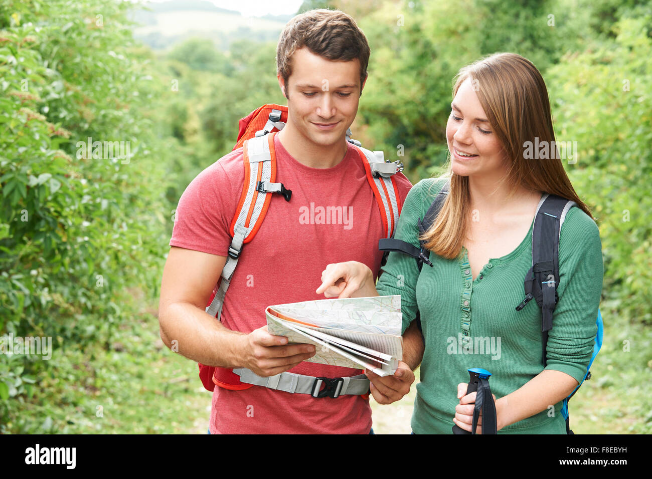 Young Couple Hiking In The Countryside Stock Photo