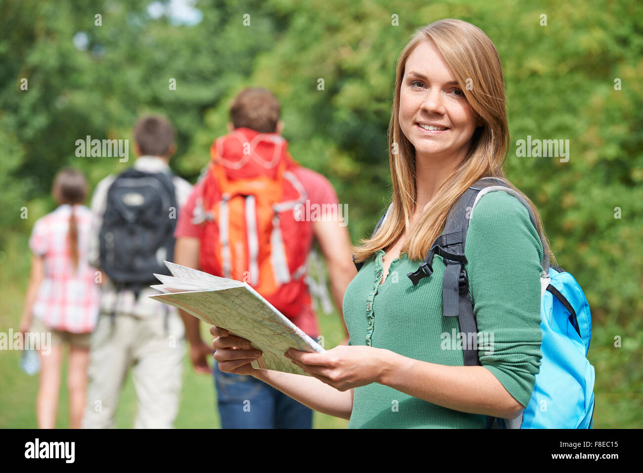 Group Of Young Friends Hiking In the Countryside Stock Photo