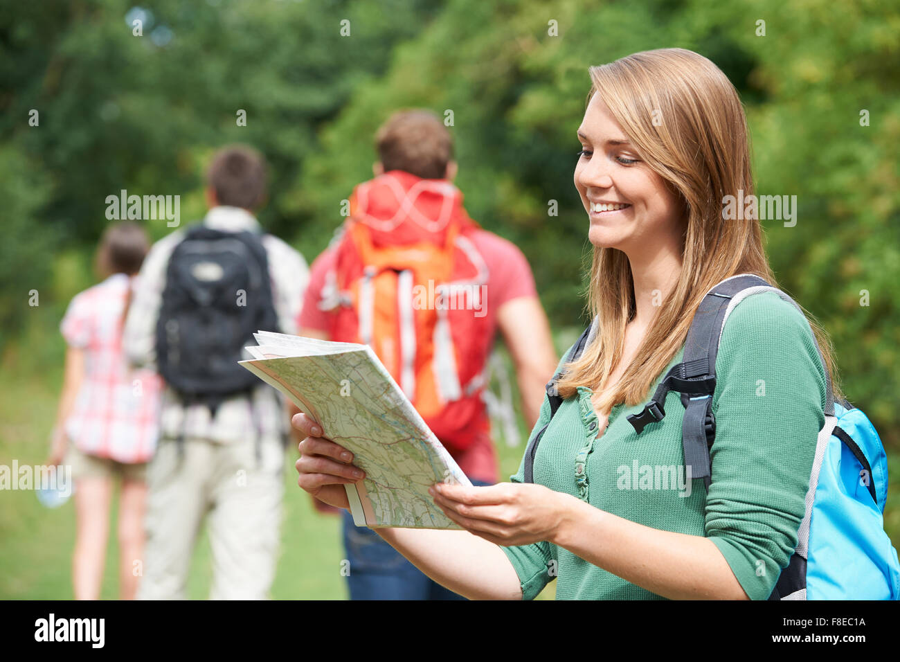 Group Of Young Friends Hiking In the Countryside Stock Photo