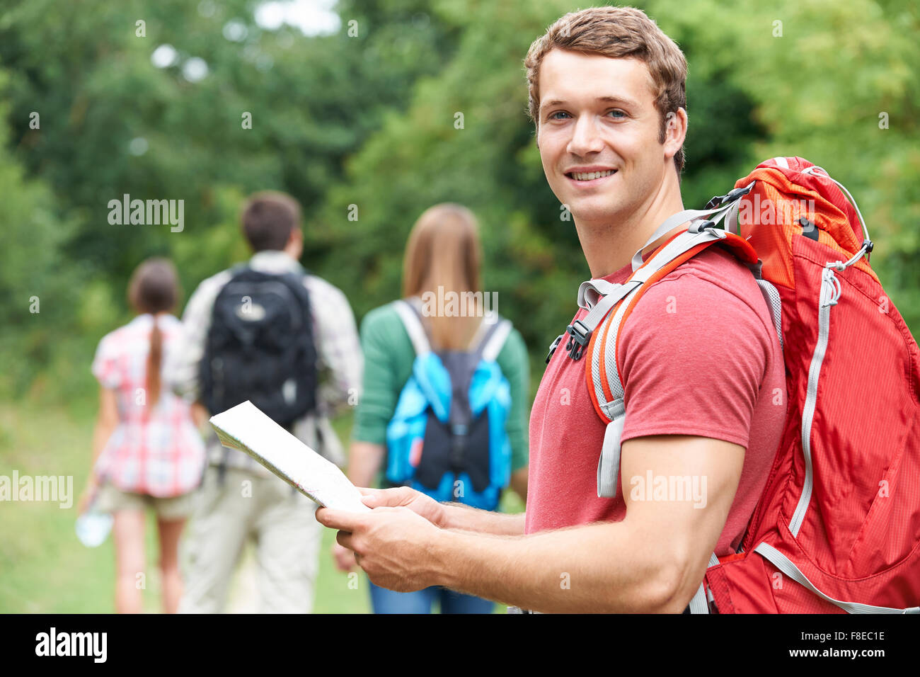 Group Of Young Friends Hiking In the Countryside Stock Photo - Alamy