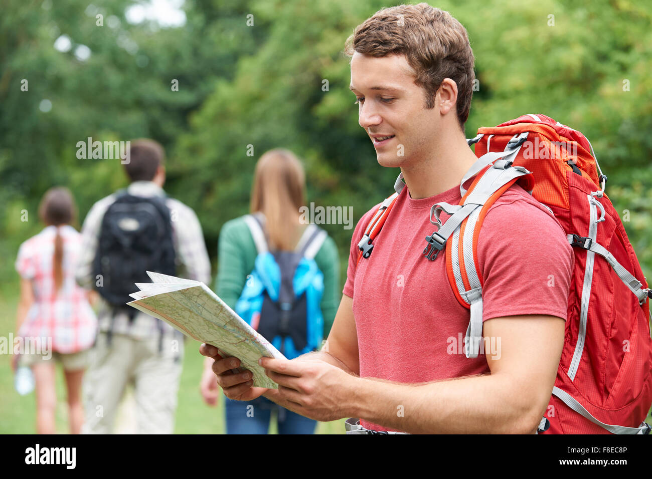 Group Of Young Friends Hiking In the Countryside Stock Photo - Alamy