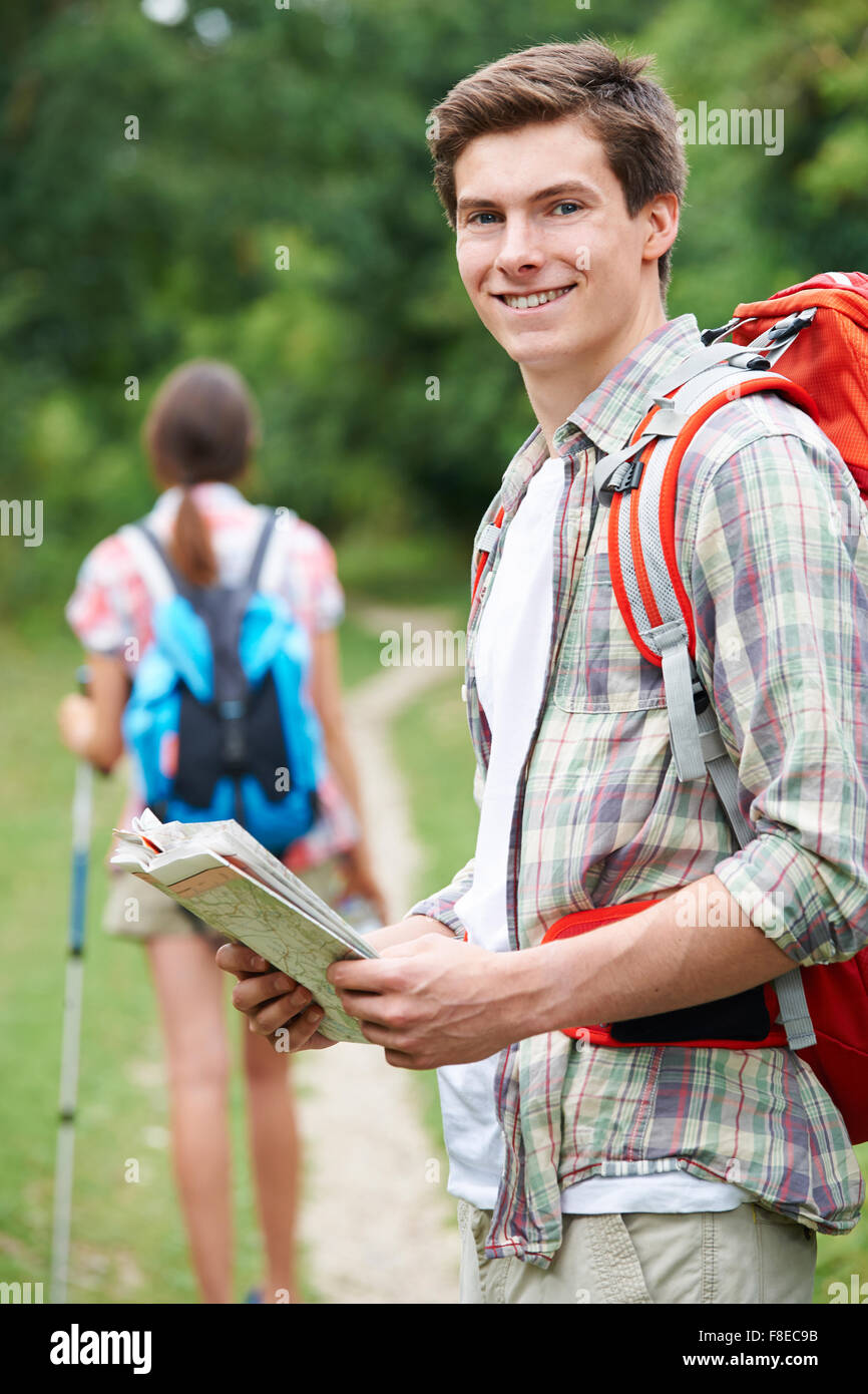 Young Couple Hiking In Countryside Stock Photo