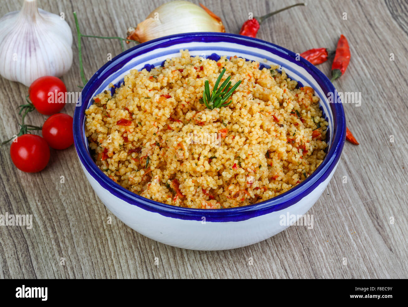 Arabic traditional cuisine Couscous with tomato and green onion Stock