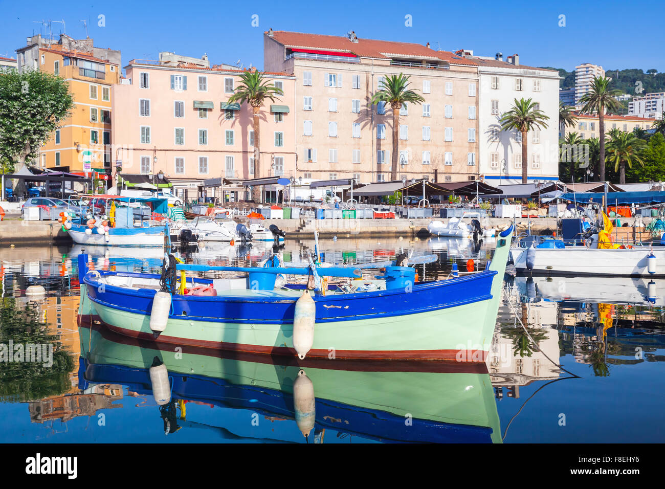 Small colorful wooden fishing boat moored in old port of Ajaccio, Corsica, France Stock Photo