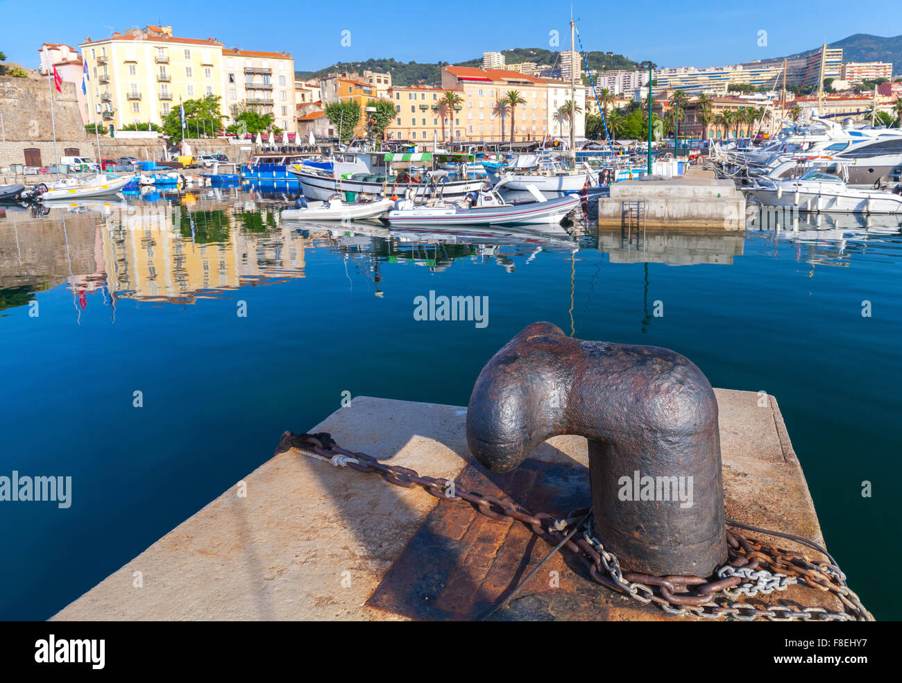 Big rusted mooring bollard in old port of Ajaccio, Corsica, France Stock Photo