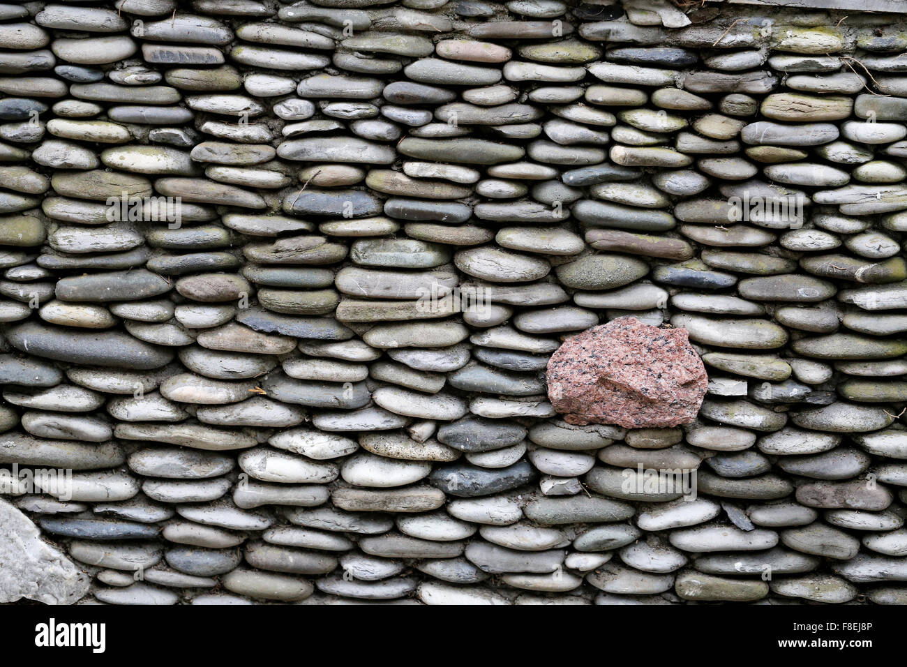 A wall of flat stones photographed close up Stock Photo