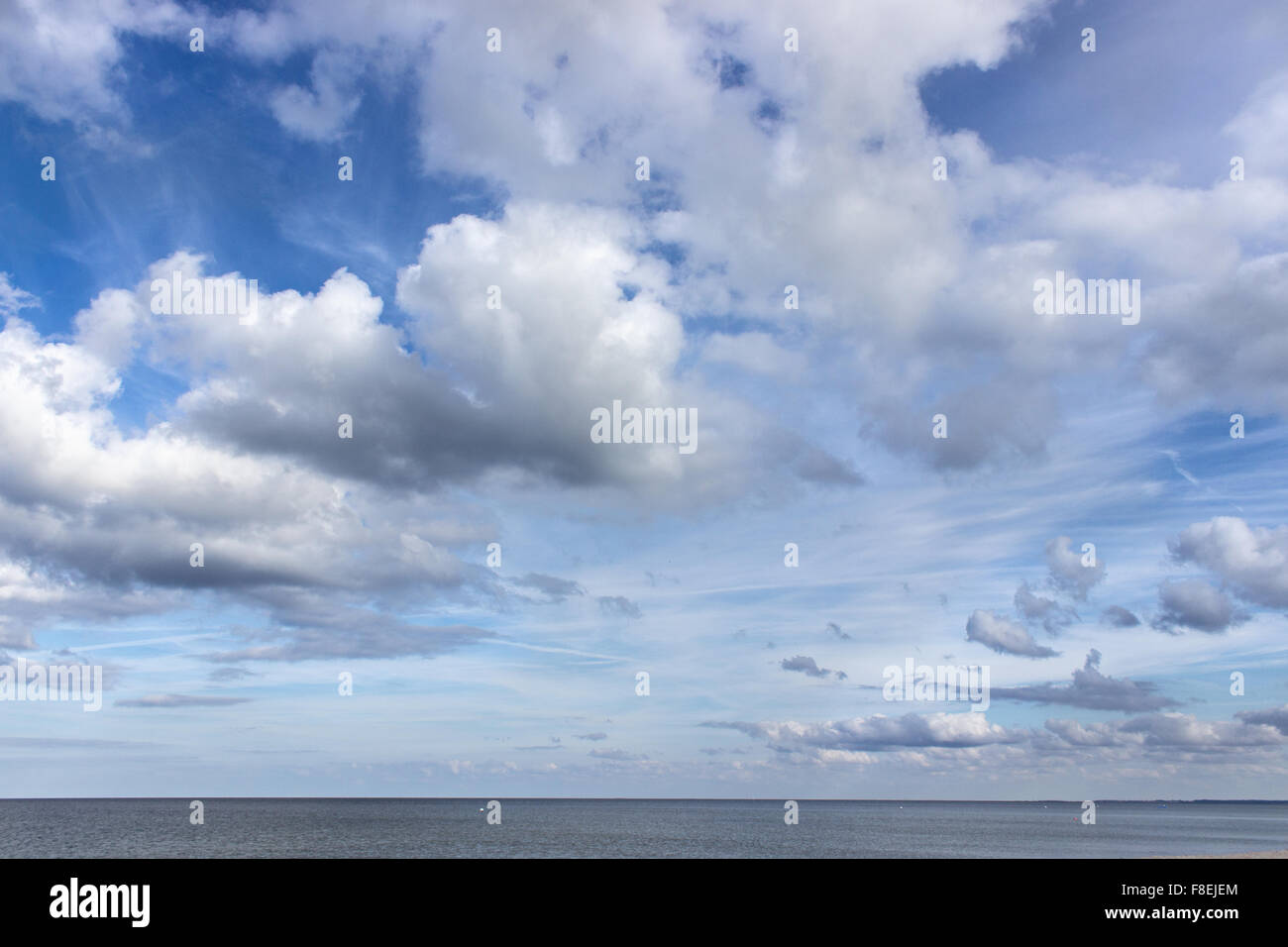 blue sky with white clouds over the ocean Stock Photo - Alamy