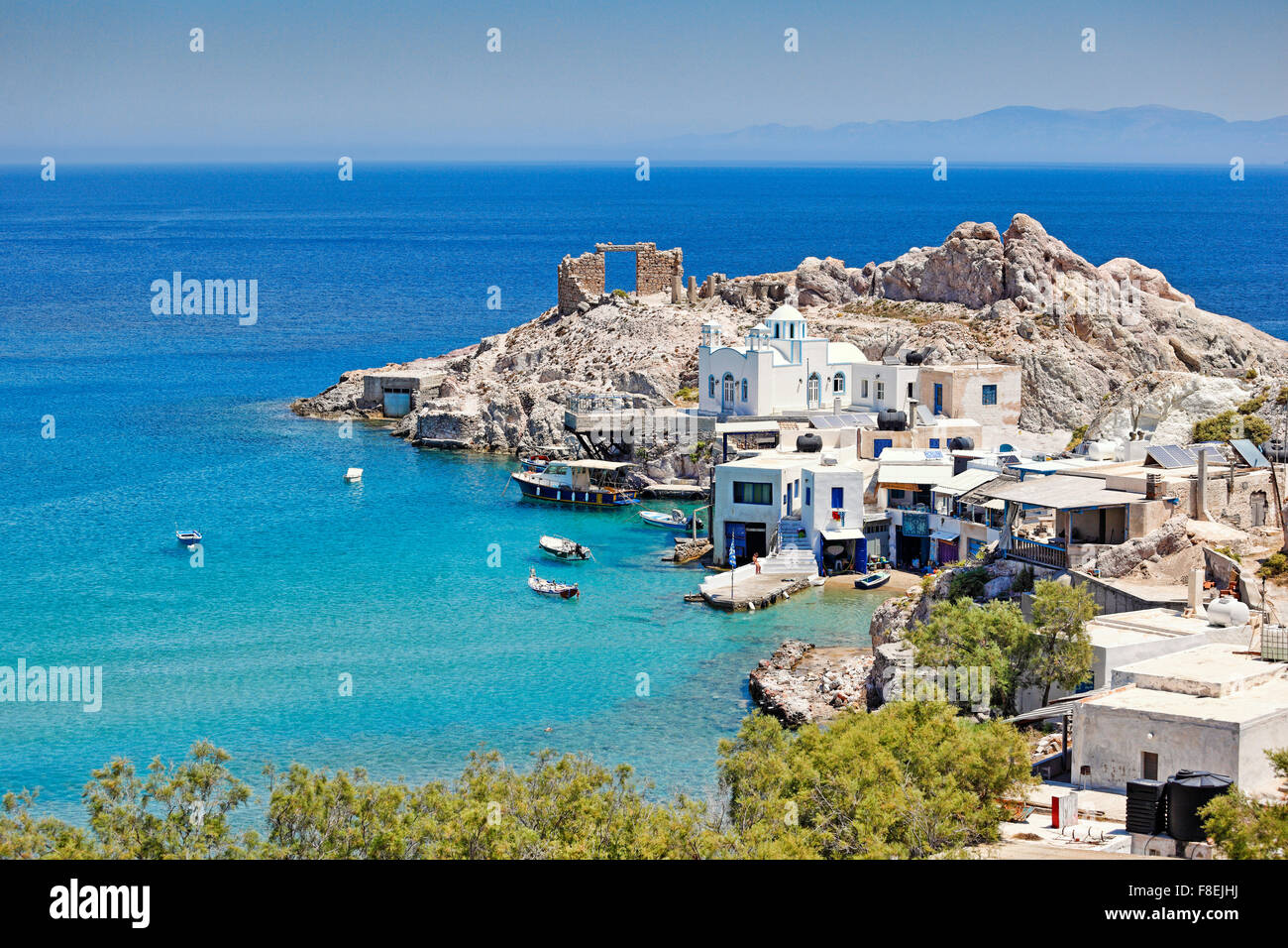 Traditional fishermen houses with the impressive boat shelters, also known as “syrmata” in Firopotamos of Milos, Greece Stock Photo