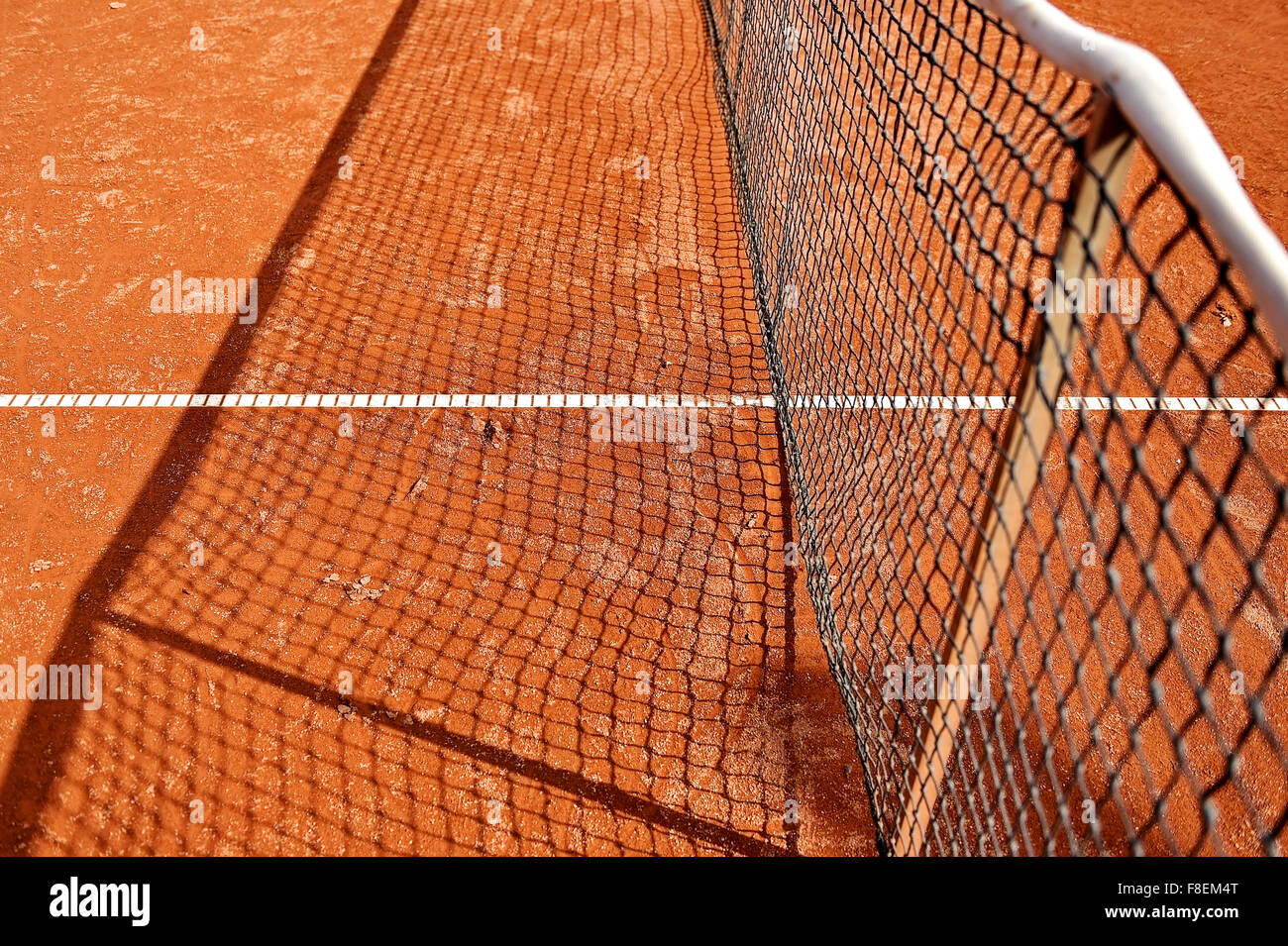 Detail shot with a tennis net on a tennis clay court Stock Photo