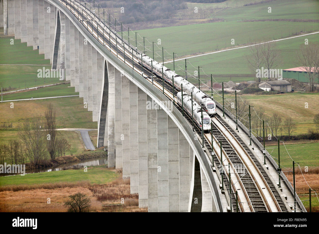 Two ICE express trains ride alongside each other during the dedication